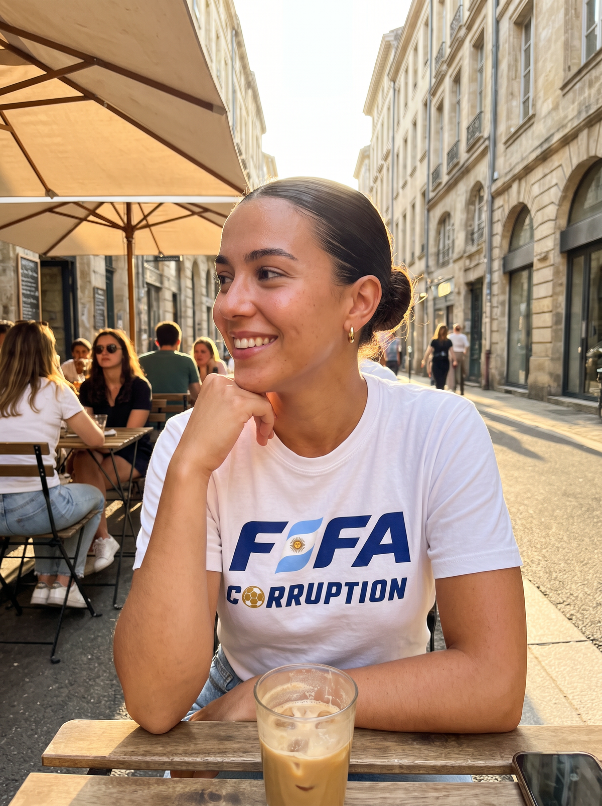 Fan at a café terrace wearing the F*FA Worldcup tee